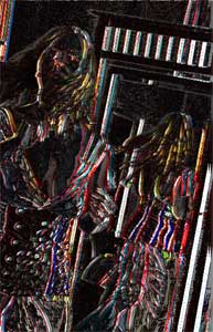 woman twirling by a mirror, rate of change function used, which has the effect of making brilliantly colored outlines against a black background
